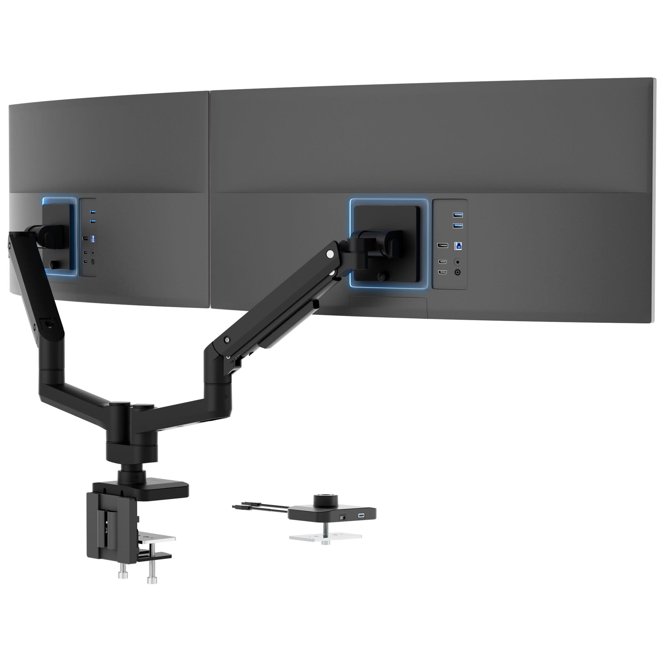 MI-12003_Main_05_alt The Mount-It! Heavy-Duty Dual Monitor Mount with Gas Spring Arms holds dual black monitors on an ergonomic desk. Shown from the back, the monitors display multiple ports and are supported by sturdy, adjustable arms for flexible positioning.