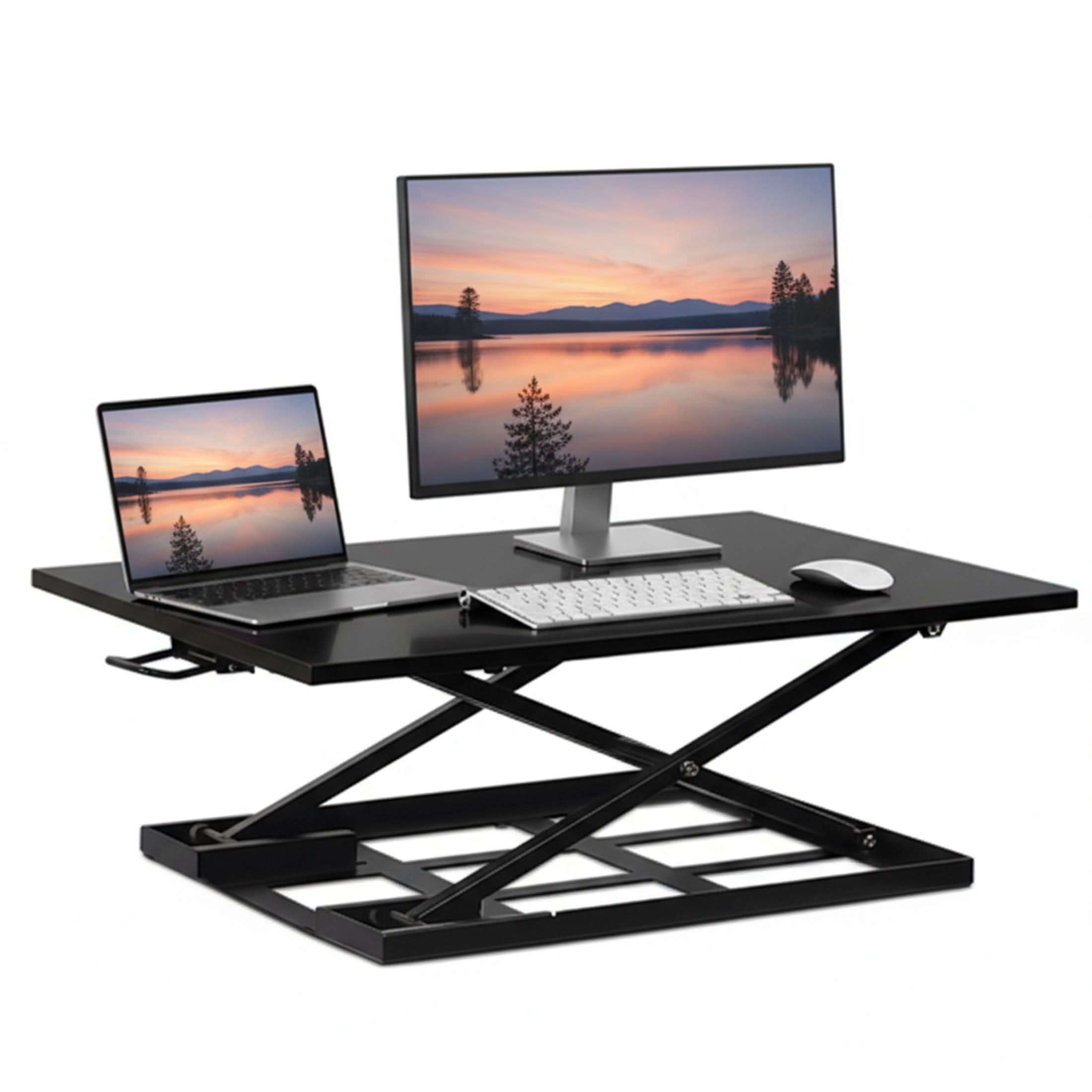 MI-7320_Main_02 The Mount-It! Height Adjustable X-Lift Standing Desk Converter in black holds a monitor, laptop, keyboard, and mouse. Both screens show a sunset lake with mountains and trees, creating an ergonomic and flexible workspace setup.